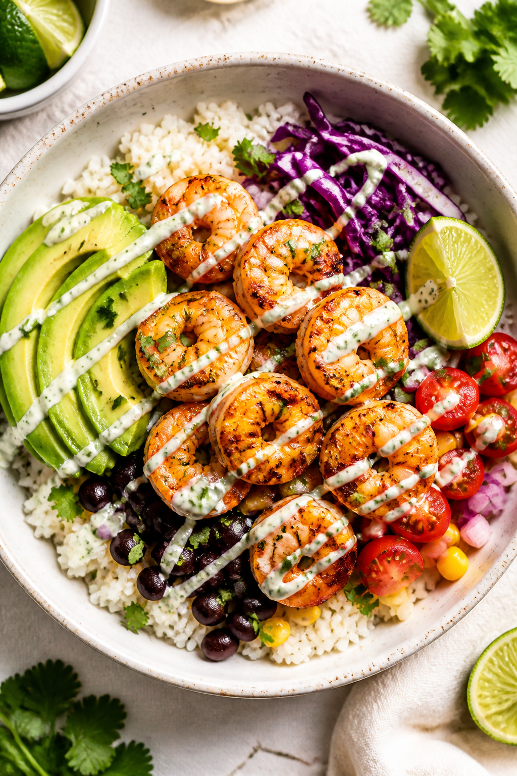 Tasty top view: Overhead shot of assembled Garlic Lime Shrimp Taco Bowl—fluffy jasmine rice base w