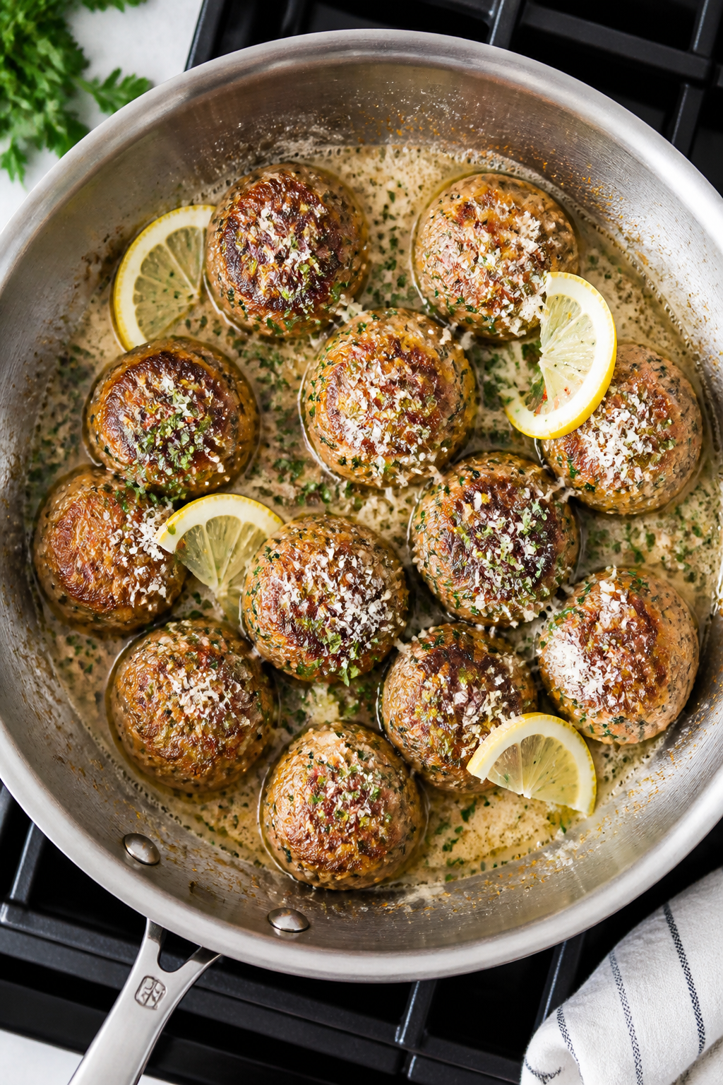 Tasty top view process shot: Overhead shot of seared turkey meatballs finishing in a skillet with me
