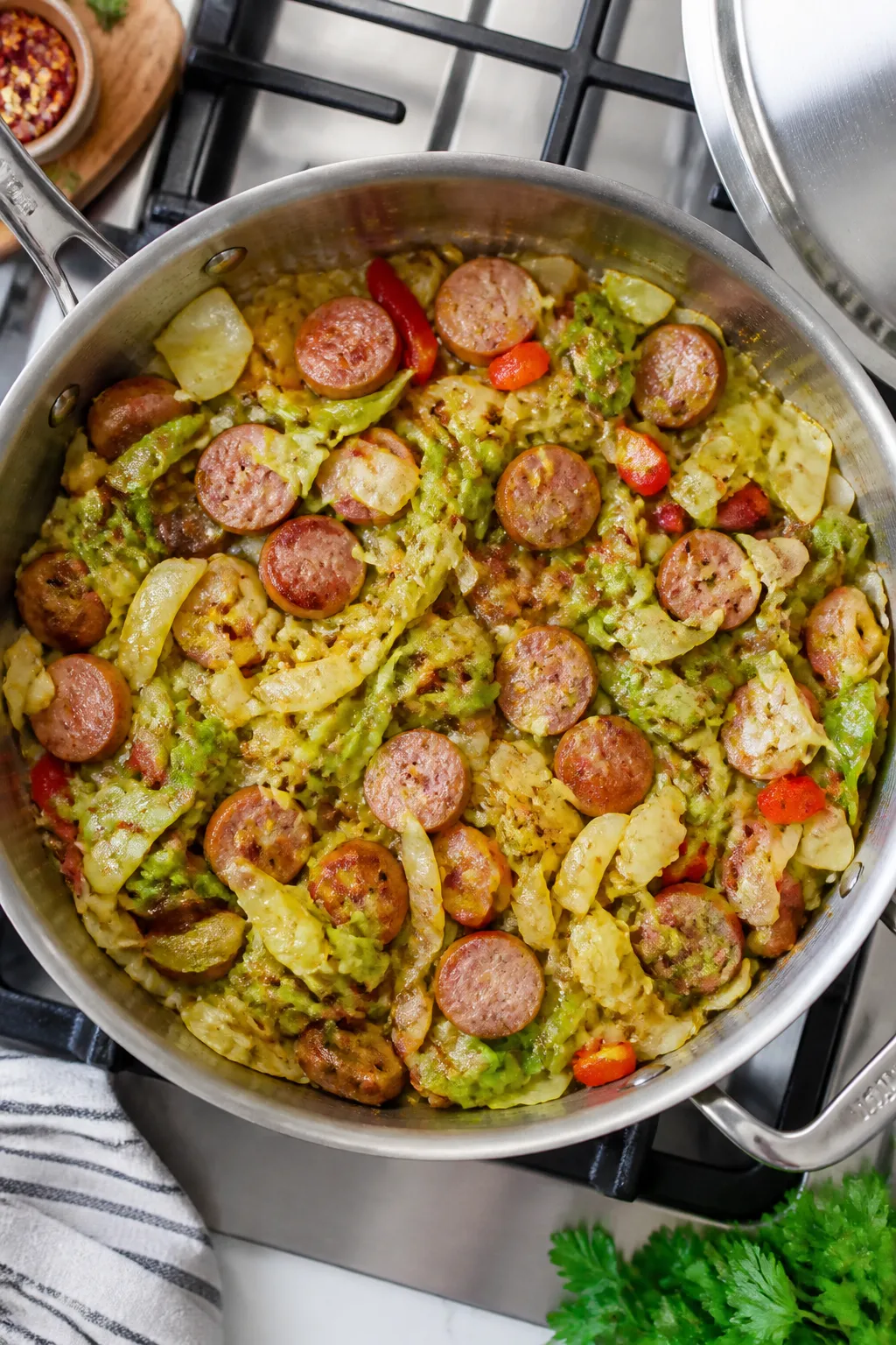 Cooking process: Overhead shot of tender-crisp cabbage and optional bell peppers and mushrooms steam