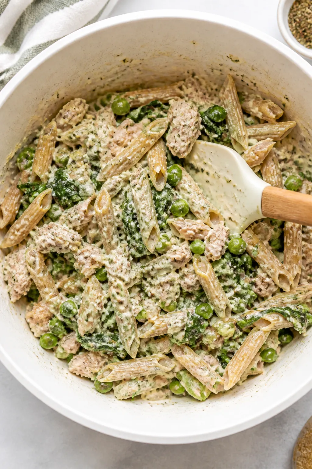 Cooking process: Overhead shot of the creamy mixture being combined before baking—al dente whole-w