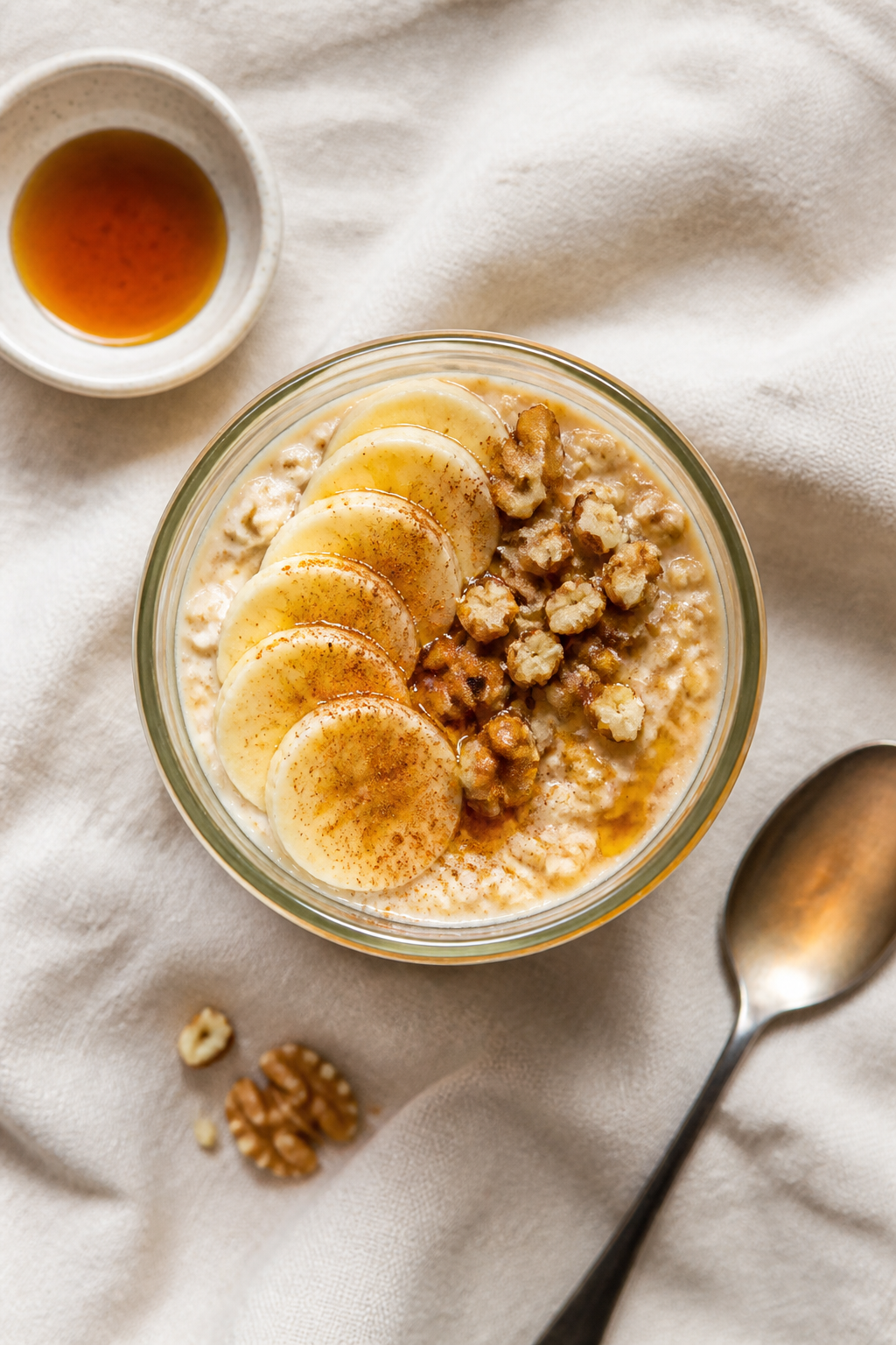 Overhead “tasty top view” of a finished jar of Maple Brown Sugar Protein Overnight Oats set on a