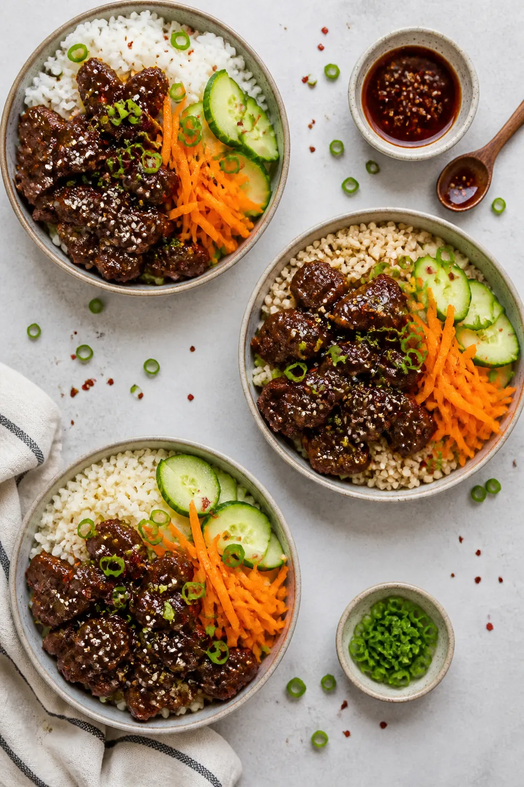Tasty overhead assembly shot: Overhead shot of assembled beef bowls for meal prep variety—three bo