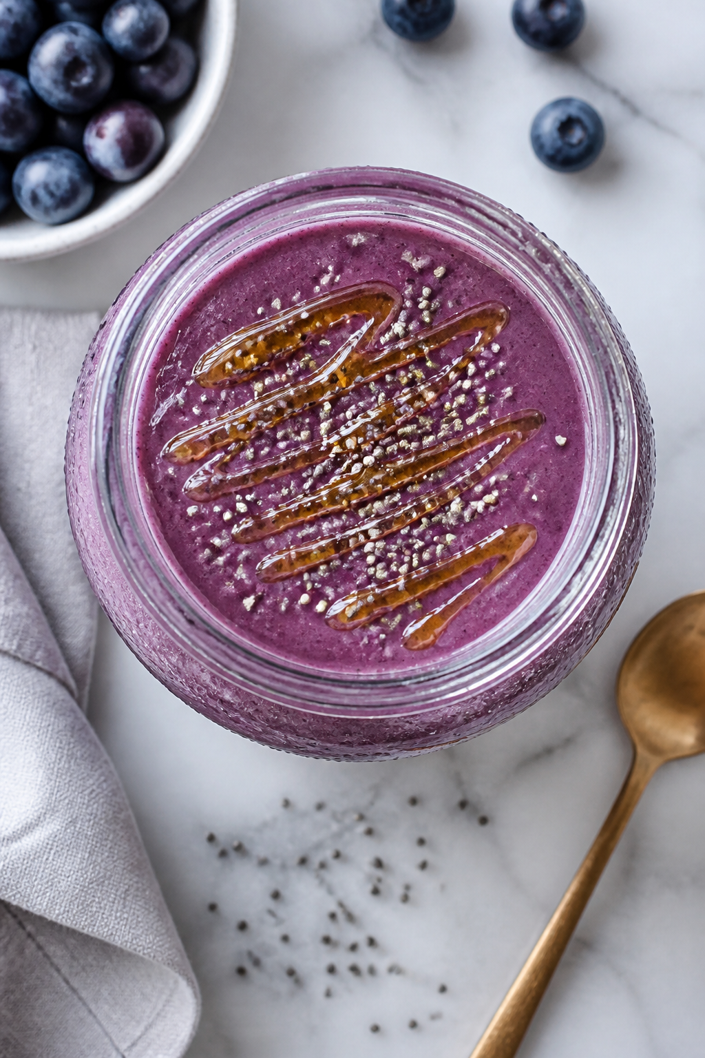 Tasty top view: Overhead shot of the finished smoothie served in a wide-mouth jar, showing luscious,